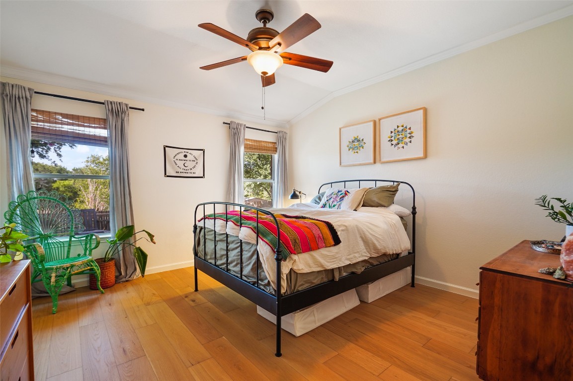 1422 Wheatfall Lane Austin, TX 78748 - Photo 19 of 29 a spacious bedroom with a bed and a table