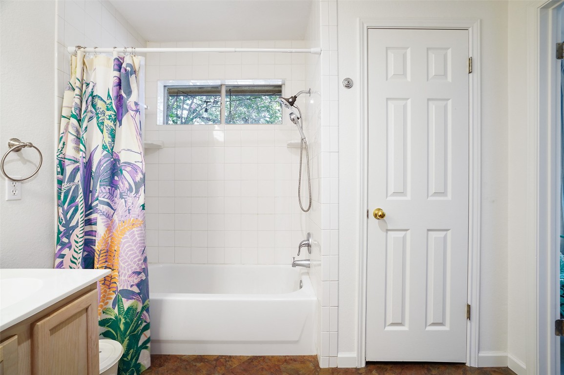 1422 Wheatfall Lane Austin, TX 78748 - Photo 22 of 29 a bathroom with a bathtub and a shower