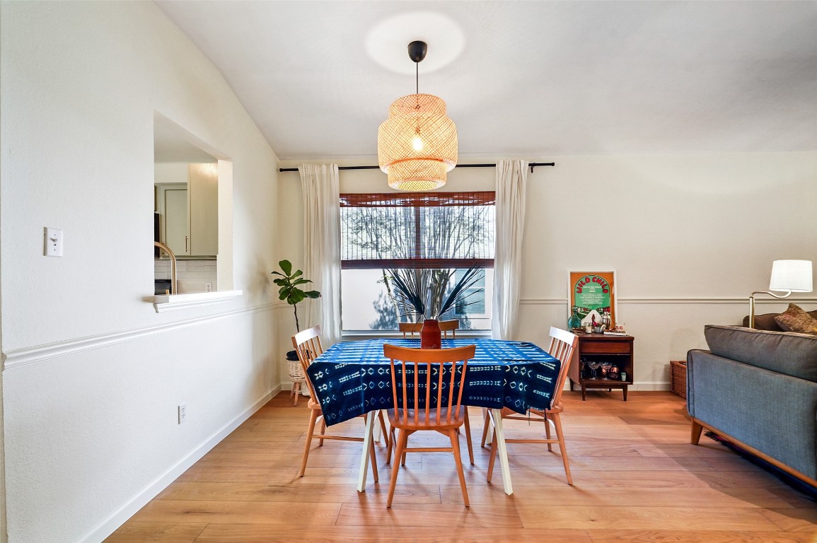 1422 Wheatfall Lane Austin, TX 78748 - Photo 8 of 29 a view of a dining room with furniture window and wooden floor