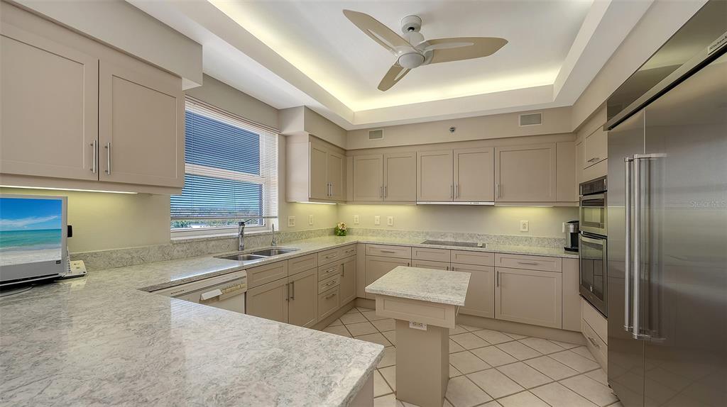 3060 Grand Bay Boulevard, Unit 155 Longboat Key, FL 34228 - Photo 13 of 67 a kitchen with a sink appliances and cabinets