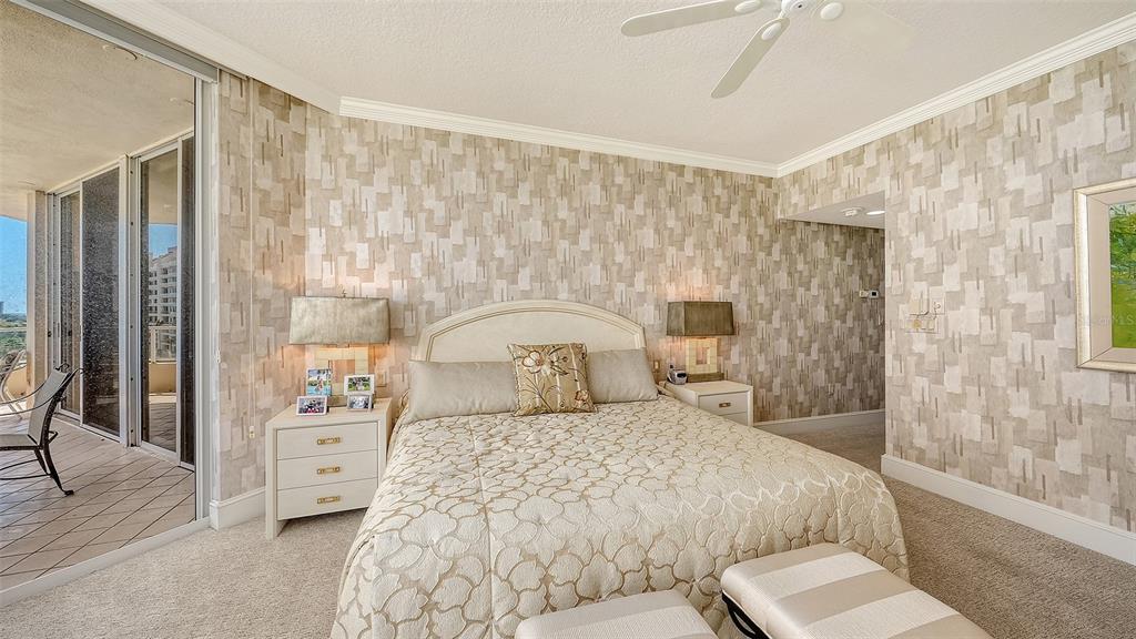 3060 Grand Bay Boulevard, Unit 155 Longboat Key, FL 34228 - Photo 21 of 67 a bedroom with a large bed and a couch