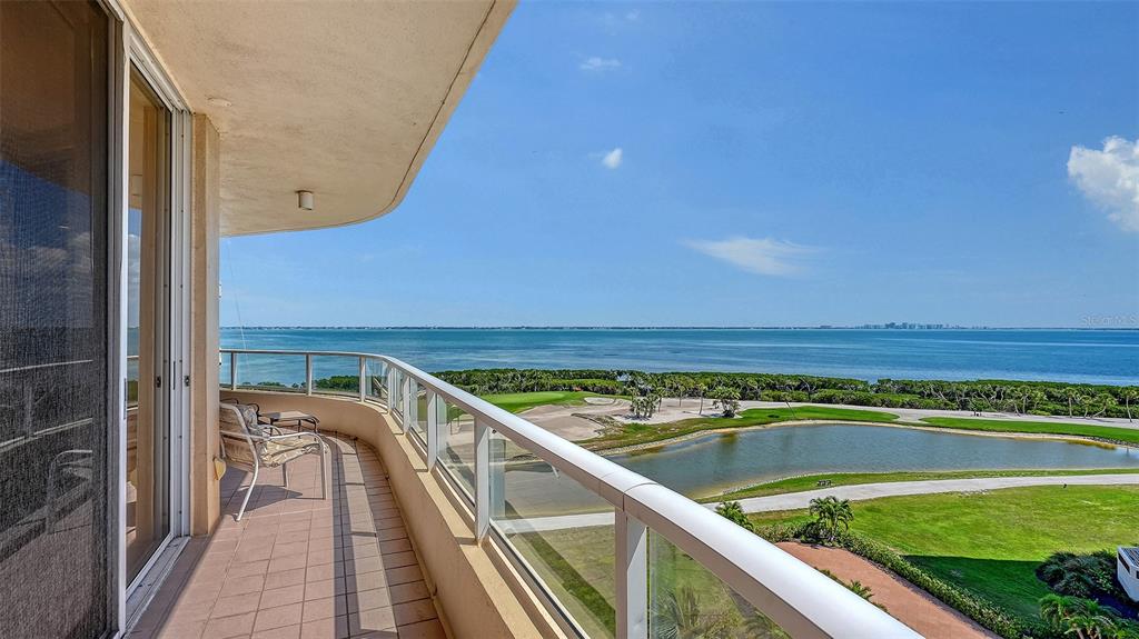 3060 Grand Bay Boulevard, Unit 155 Longboat Key, FL 34228 - Photo 29 of 67 a view of a swimming pool with seating area