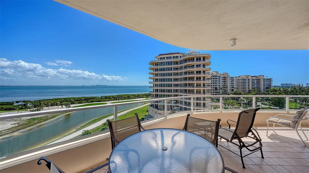 3060 Grand Bay Boulevard, Unit 155 Longboat Key, FL 34228 - Photo 3 of 67 a roof deck with outdoor seating and city view