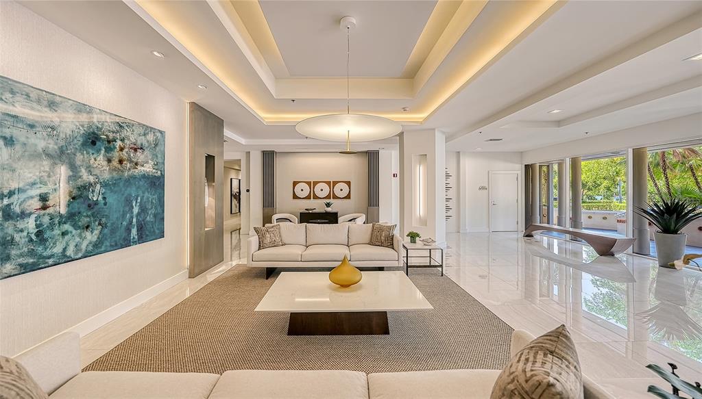 3060 Grand Bay Boulevard, Unit 155 Longboat Key, FL 34228 - Photo 40 of 67 a living room with furniture and a large window