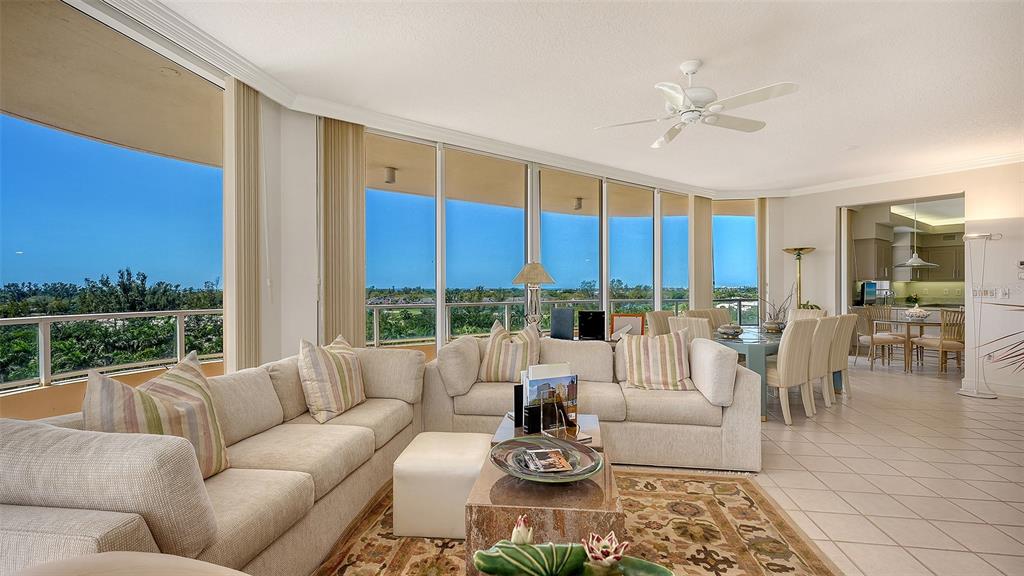 3060 Grand Bay Boulevard, Unit 155 Longboat Key, FL 34228 - Photo 4 of 67 a living room with furniture and large windows