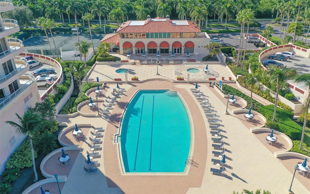3060 Grand Bay Boulevard, Unit 155 Longboat Key, FL 34228 - Photo 43 of 67 an aerial view of a house with swimming pool and outdoor seating