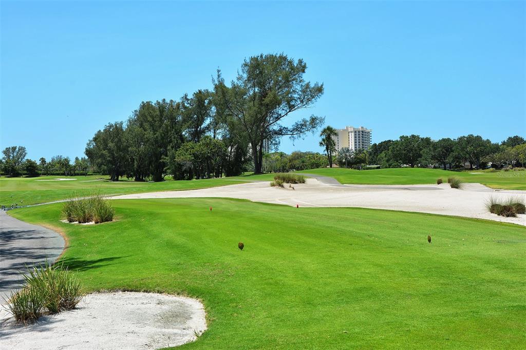 3060 Grand Bay Boulevard, Unit 155 Longboat Key, FL 34228 - Photo 58 of 67 a view of a golf course with a lake