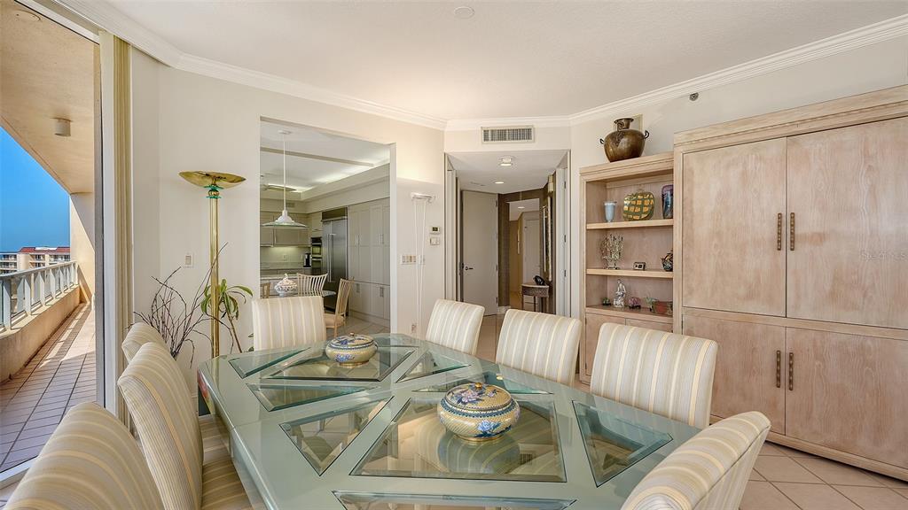 3060 Grand Bay Boulevard, Unit 155 Longboat Key, FL 34228 - Photo 8 of 67 a living room with furniture and a table