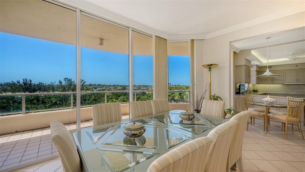 3060 Grand Bay Boulevard, Unit 155 Longboat Key, FL 34228 - Photo 9 of 67 a view of a dining room with furniture