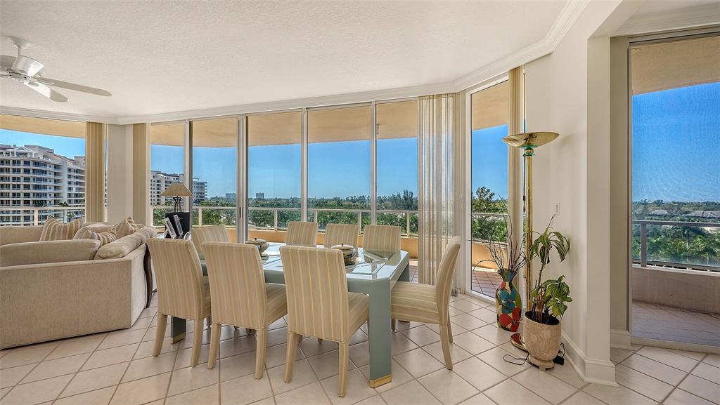 3060 Grand Bay Boulevard, Unit 155 Longboat Key, FL 34228 - Photo 10 of 67 a living room with furniture and a large window