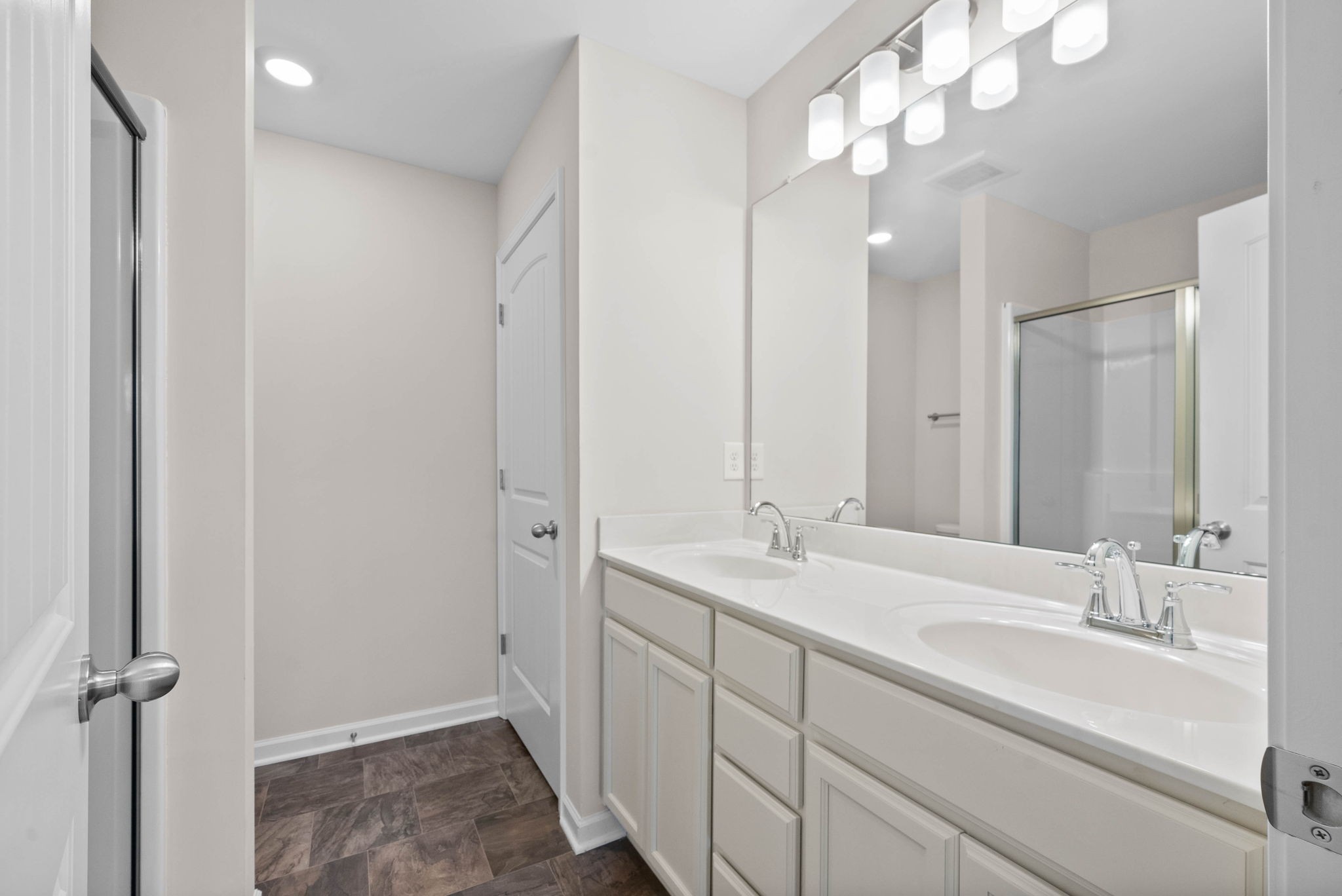 175 Addi Street Pleasant View, TN 37146 - Photo 19 of 22 a bathroom with a double vanity sink and a mirror
