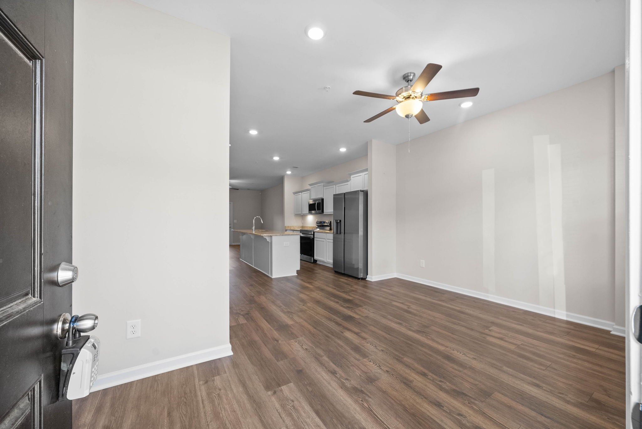 175 Addi Street Pleasant View, TN 37146 - Photo 3 of 22 wooden floor in an empty room with a window