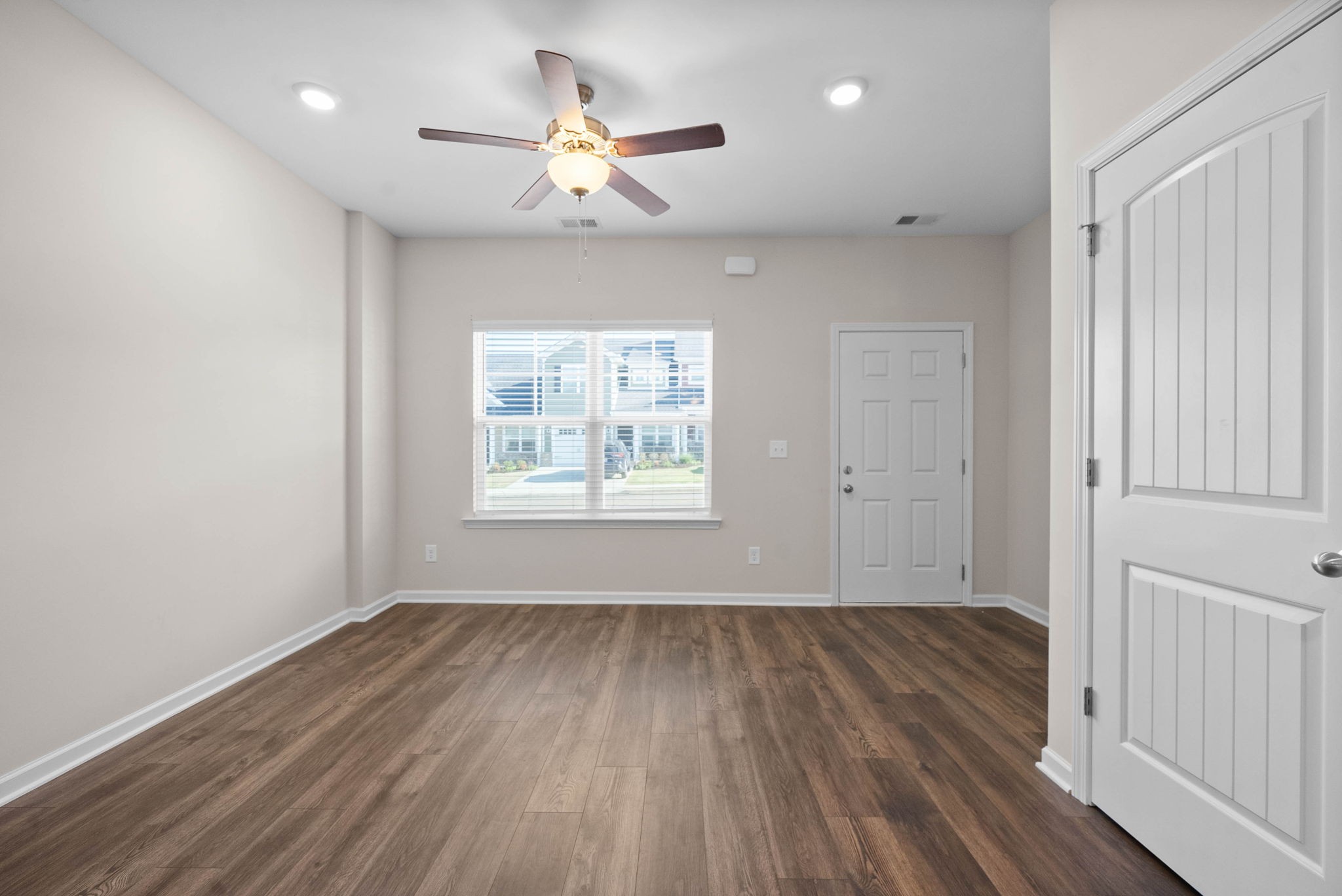 175 Addi Street Pleasant View, TN 37146 - Photo 5 of 22 an empty room with wooden floor and windows