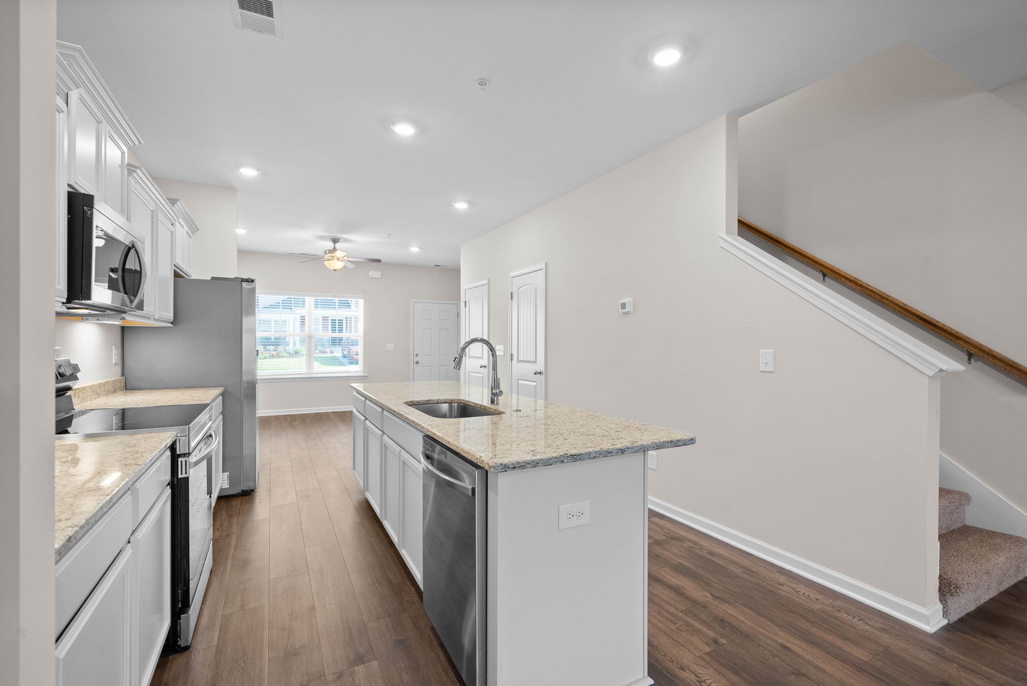 175 Addi Street Pleasant View, TN 37146 - Photo 9 of 22 a kitchen with stainless steel appliances granite countertop a sink stove and refrigerator