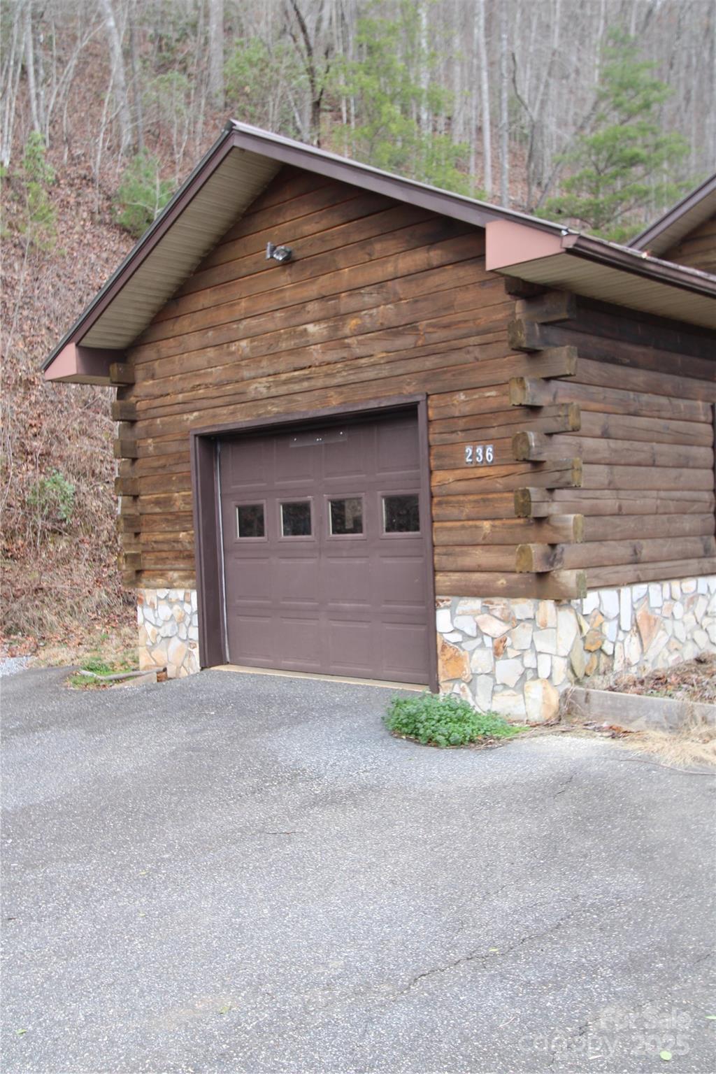 236 Plainview Ridge Sylva, NC 28779 - Photo 17 of 21 a front view of a house with a yard and garage