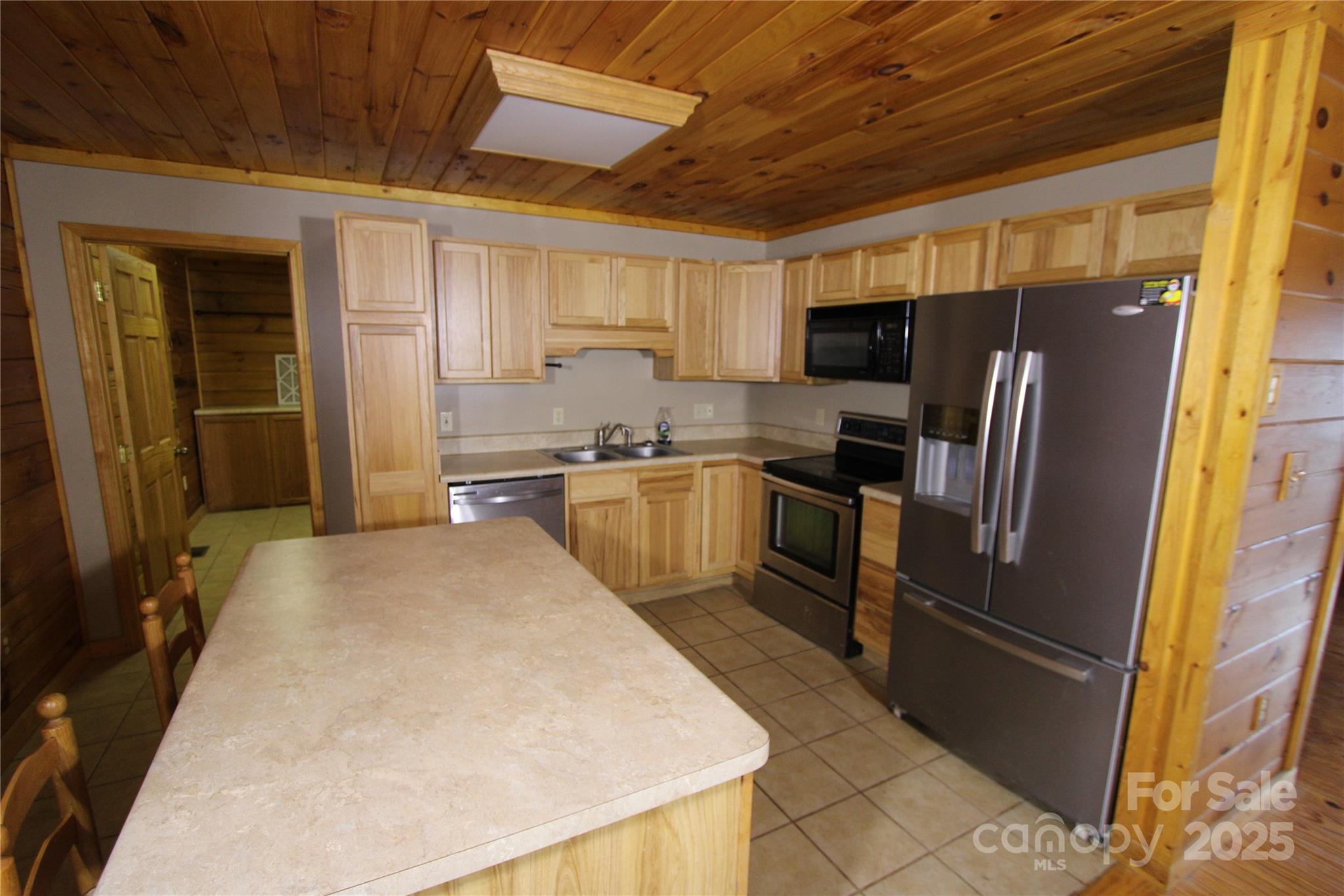 236 Plainview Ridge Sylva, NC 28779 - Photo 3 of 21 a kitchen with stainless steel appliances granite countertop a refrigerator stove microwave and sink