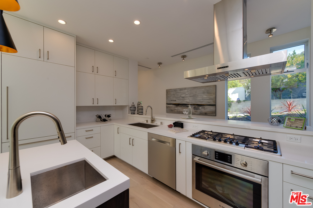3431 Coy Drive Sherman Oaks, CA 91423 - Photo 17 of 54 a kitchen with a stove and a sink