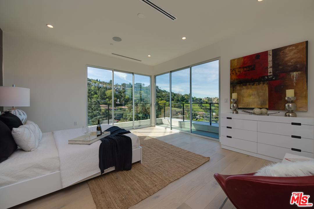 3431 Coy Drive Sherman Oaks, CA 91423 - Photo 20 of 54 a living room with furniture large window and a flat screen tv