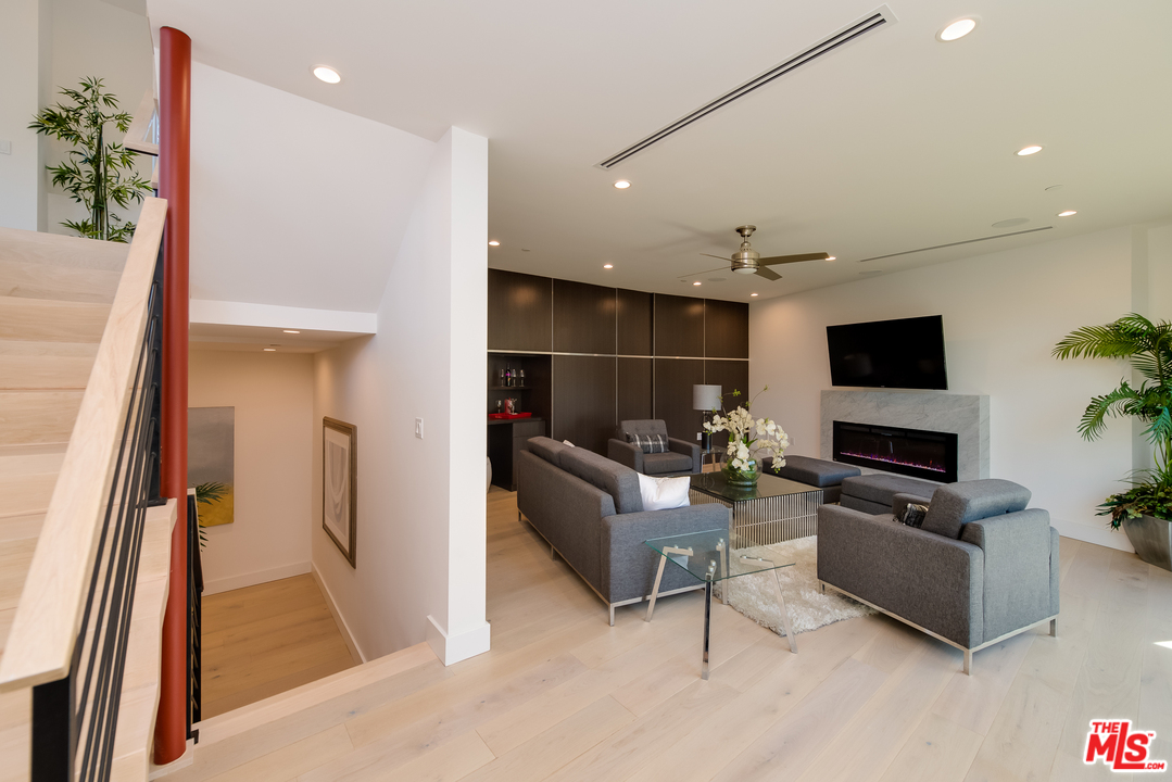 3431 Coy Drive Sherman Oaks, CA 91423 - Photo 35 of 54 a living room with furniture and a flat screen tv