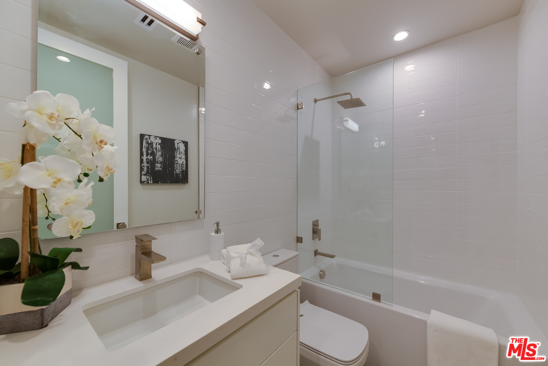 3431 Coy Drive Sherman Oaks, CA 91423 - Photo 44 of 54 a bathroom with a sink toilet and shower