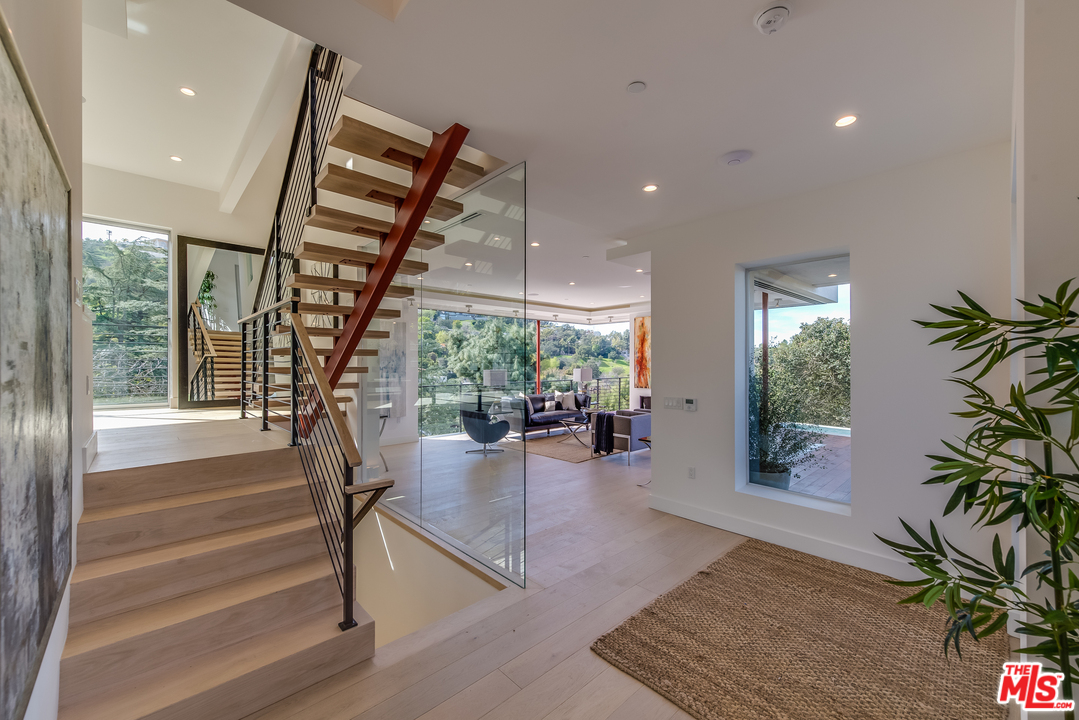 3431 Coy Drive Sherman Oaks, CA 91423 - Photo 6 of 54 a view of entryway livingroom and hall with wooden floor