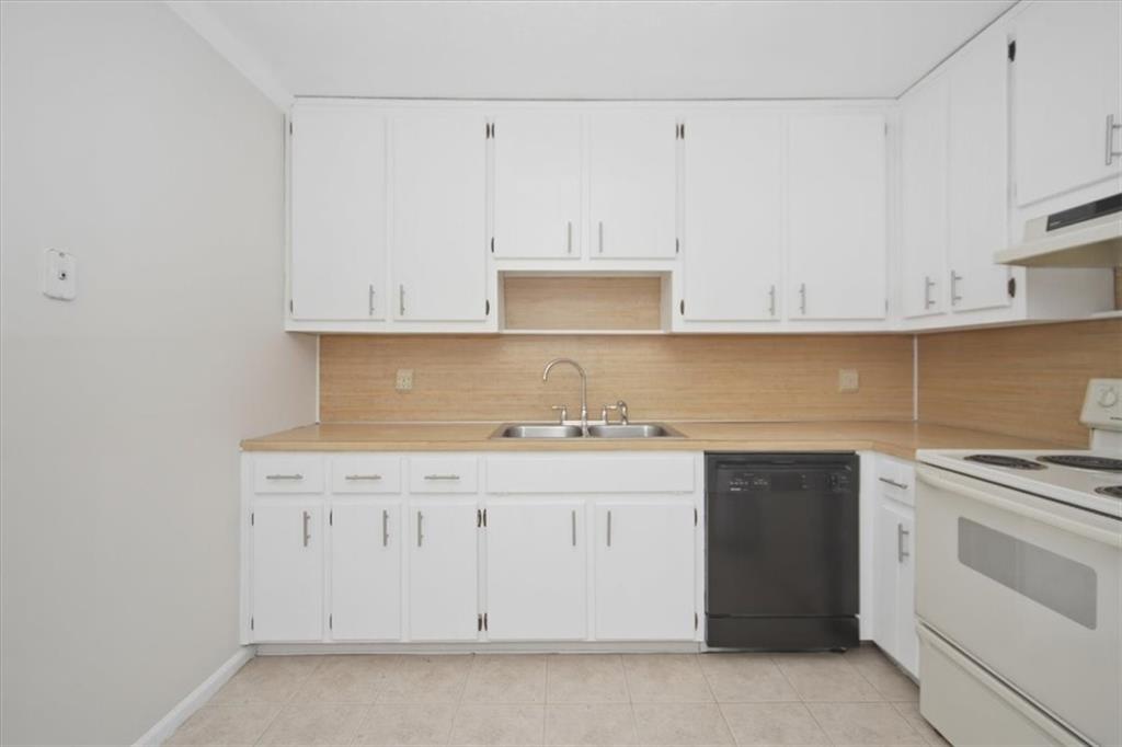 142 Deer Run Canton, GA 30114 - Photo 17 of 24 a kitchen with white cabinets