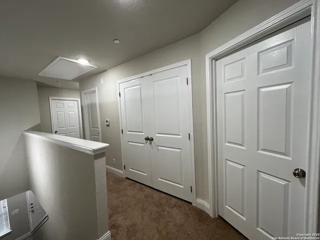 a view of a livingroom with an empty space and a window