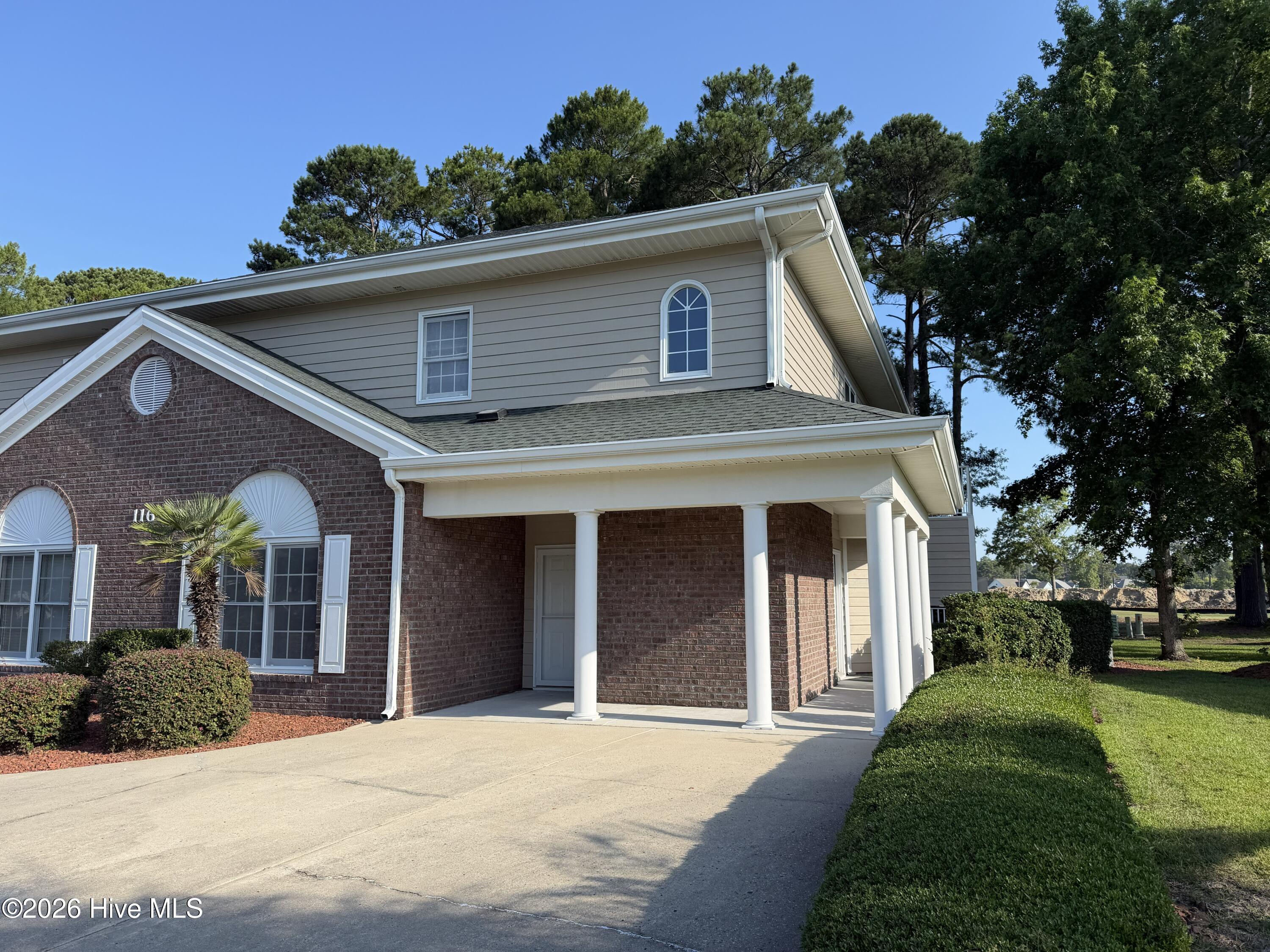 116 Rice Mill Circle, Unit 4 Sunset Beach, NC 28468 - Photo 1 of 29 Front of condo. Unit is second floor unit. Entrance to condo is to the right.