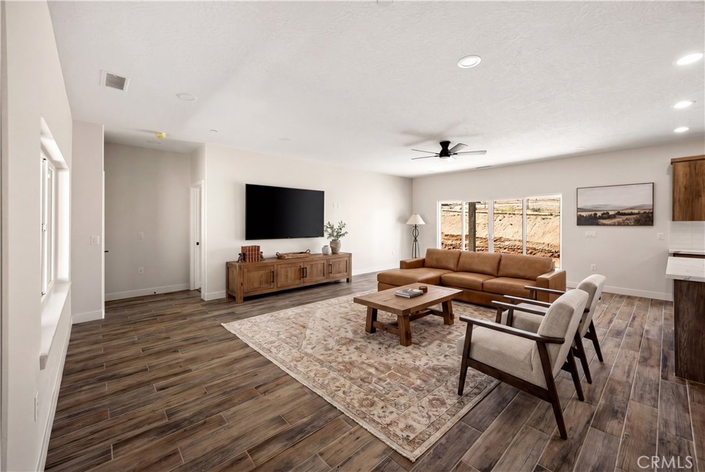 22324 Rancho Street Apple Valley, CA 92308 - Photo 3 of 47 a living room with furniture and a flat screen tv