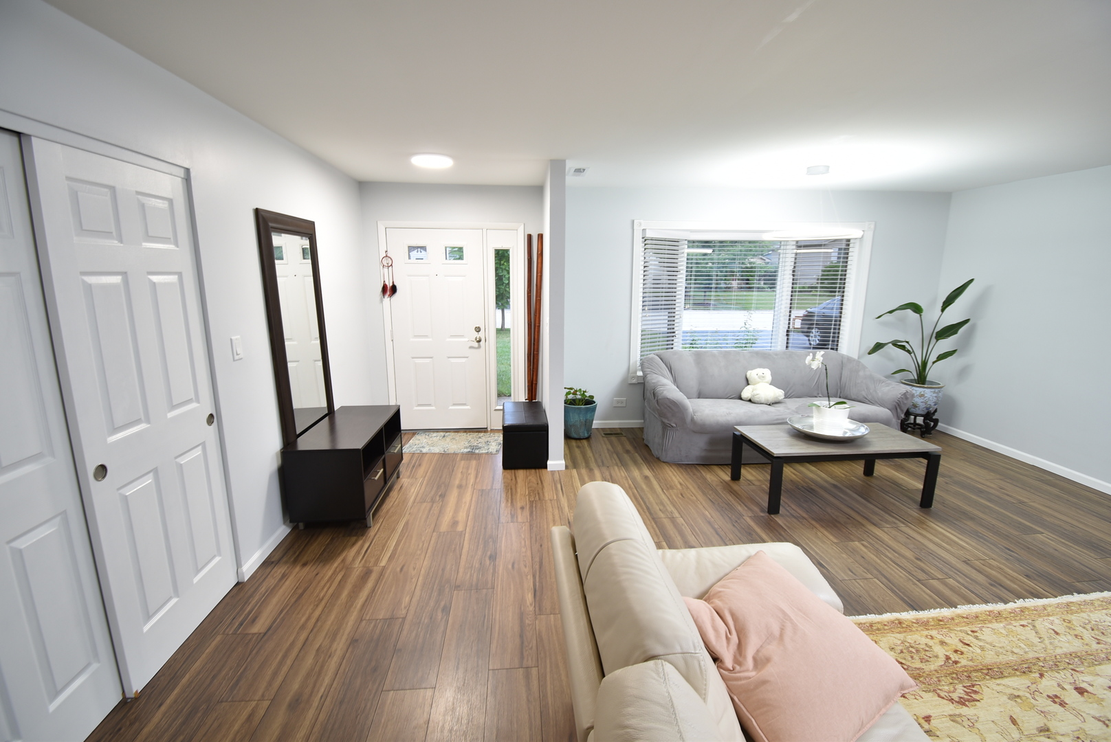 a living room with furniture and a table