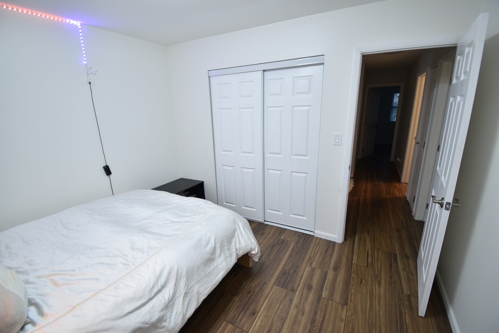 440 Red Bridge Road Lake Zurich, IL 60047 - Photo 7 of 15 a bedroom with a bed and wooden floor