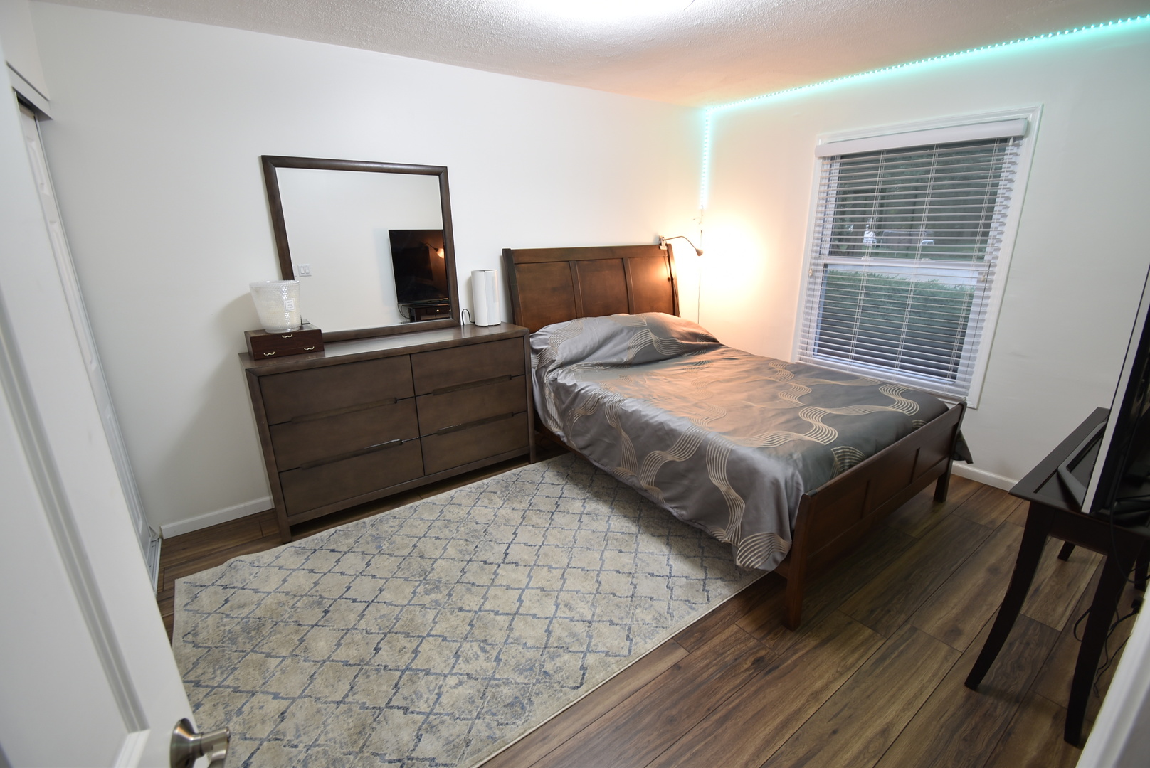 440 Red Bridge Road Lake Zurich, IL 60047 - Photo 8 of 15 a bedroom with a bed and wooden floor