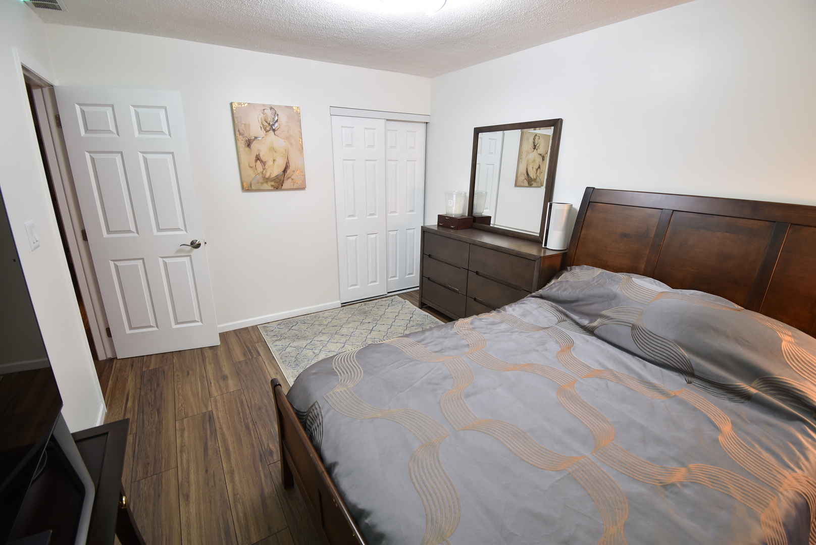 440 Red Bridge Road Lake Zurich, IL 60047 - Photo 9 of 15 a bedroom with a bed and wooden floor