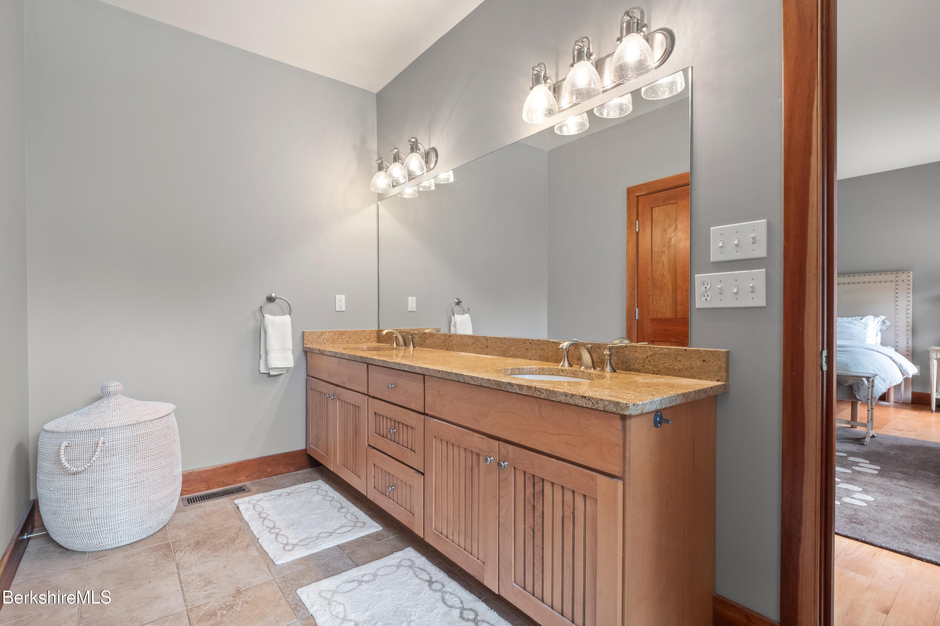 62 Stockbridge Terrace Lee, MA 01238 - Photo 22 of 49 a bathroom with a granite countertop sink and a mirror