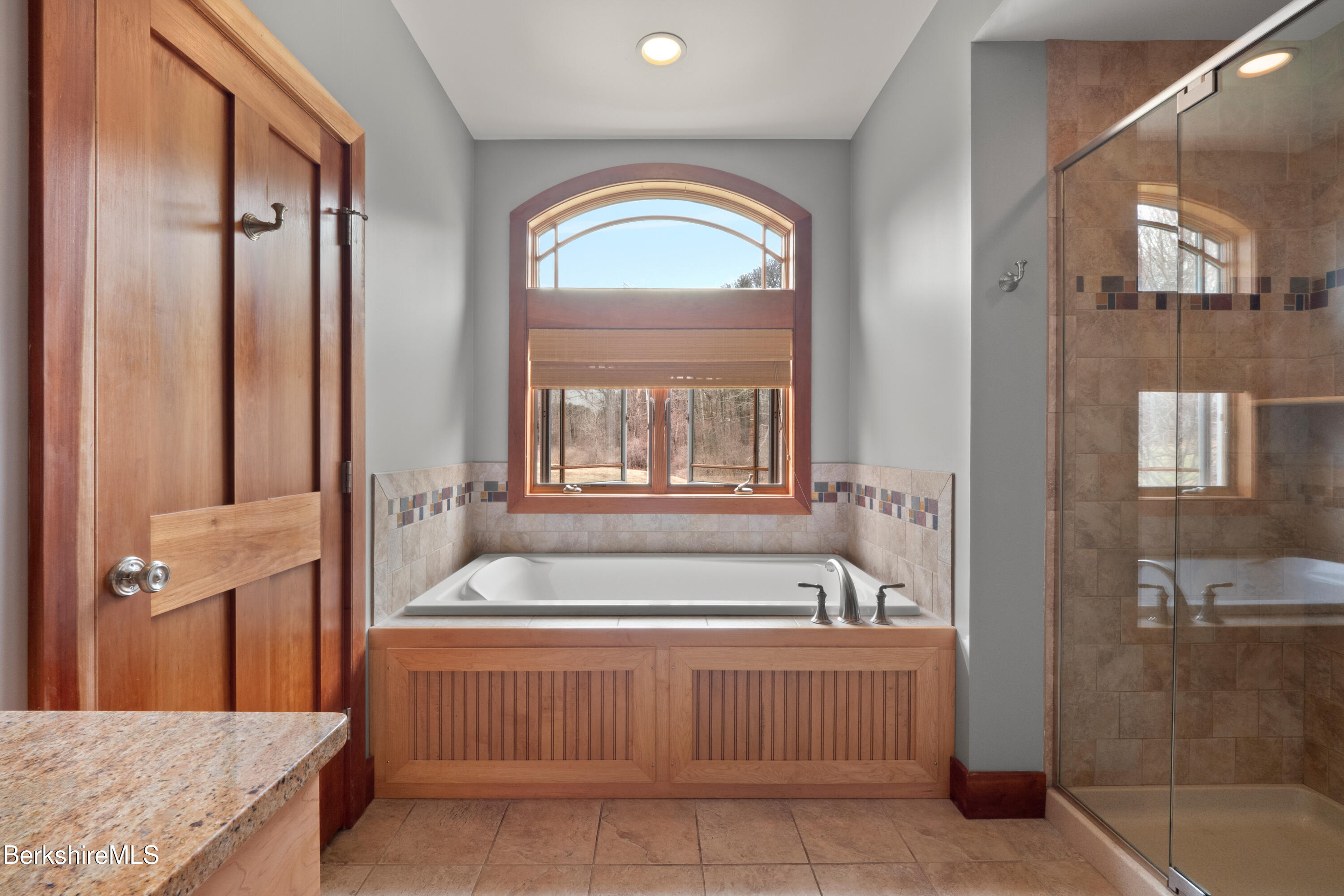 62 Stockbridge Terrace Lee, MA 01238 - Photo 23 of 49 a spacious bathroom with a tub a sink and a mirror