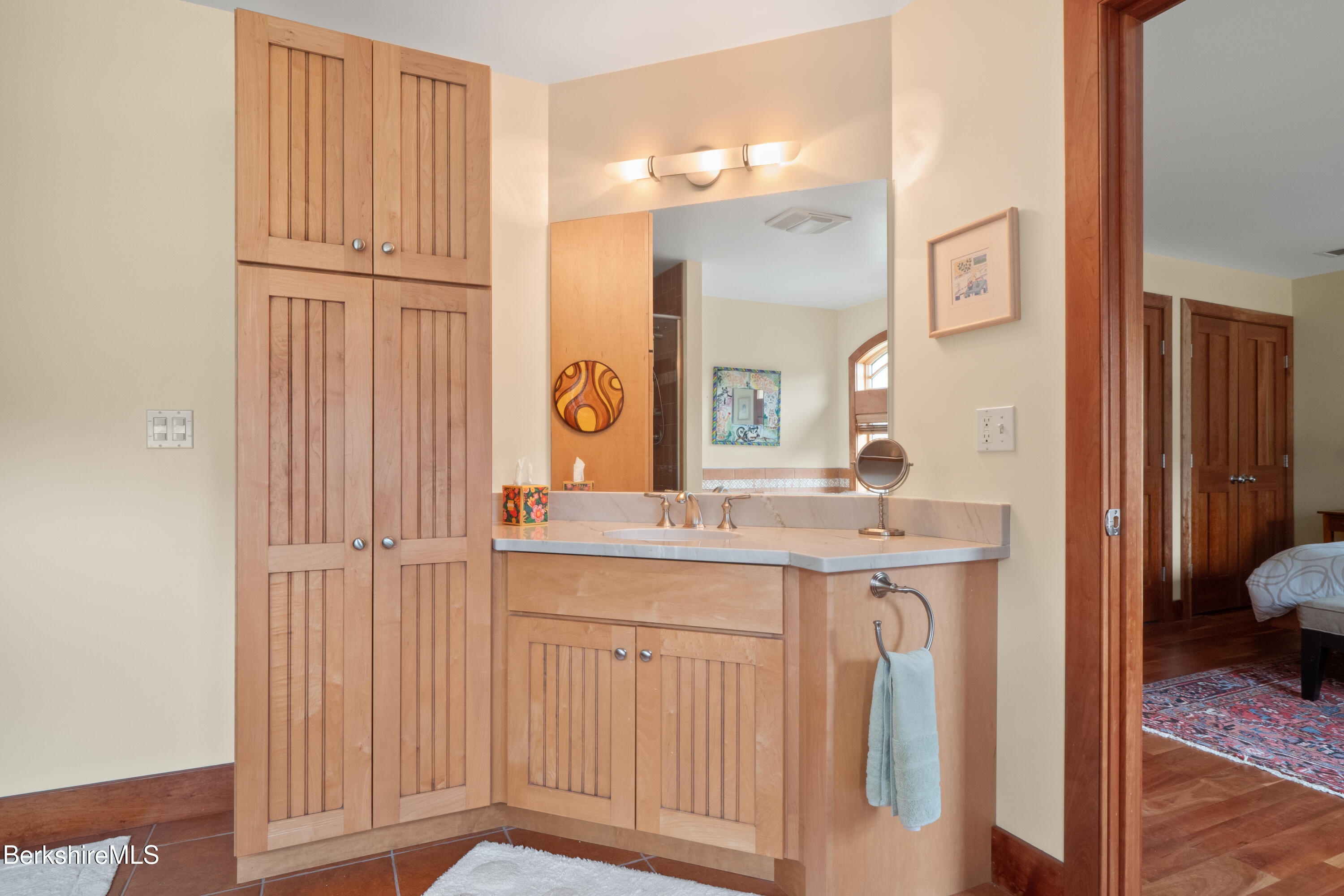 62 Stockbridge Terrace Lee, MA 01238 - Photo 34 of 49 a bathroom with a granite countertop sink and a mirror
