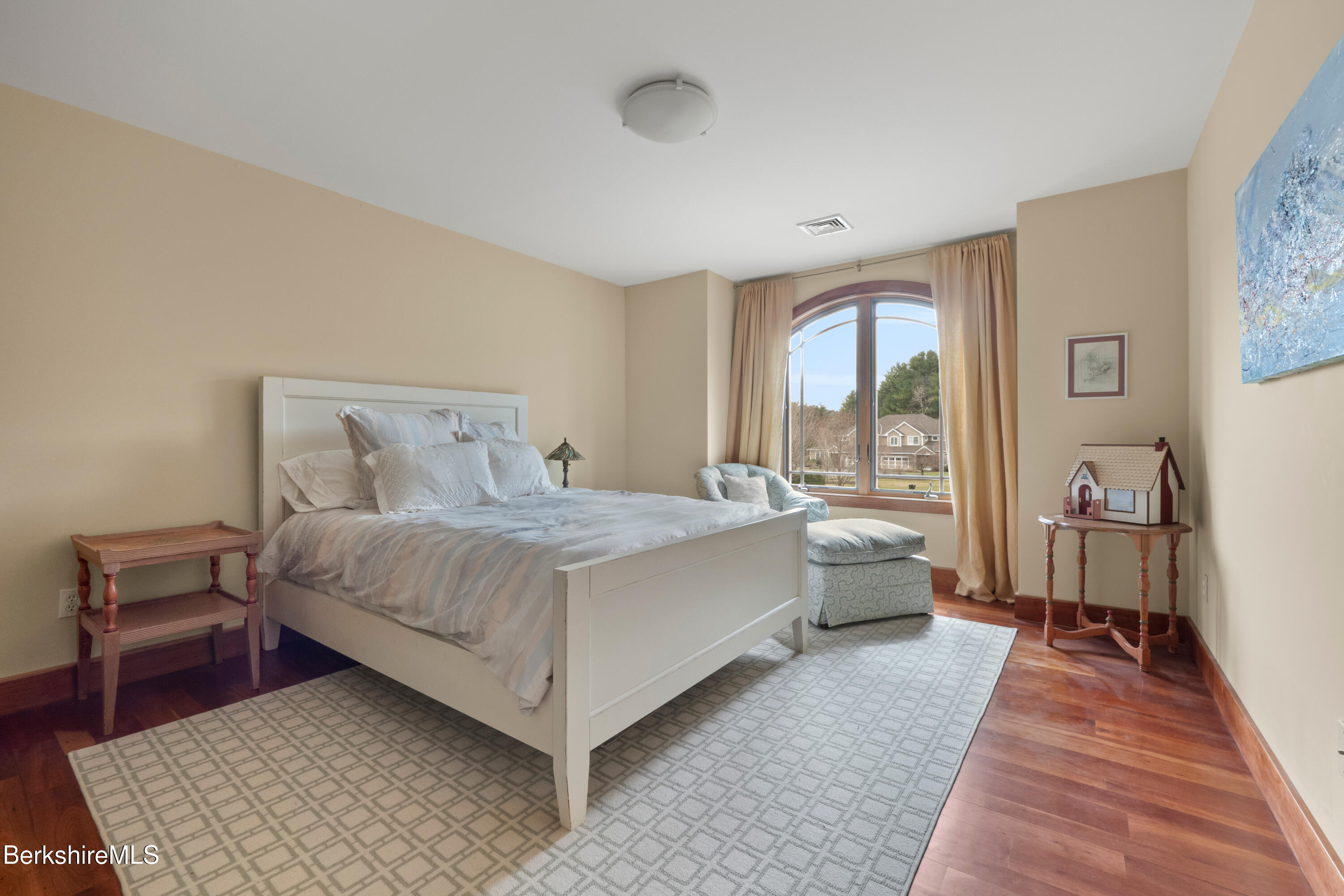 62 Stockbridge Terrace Lee, MA 01238 - Photo 35 of 49 a bed room with a bed and wooden floor