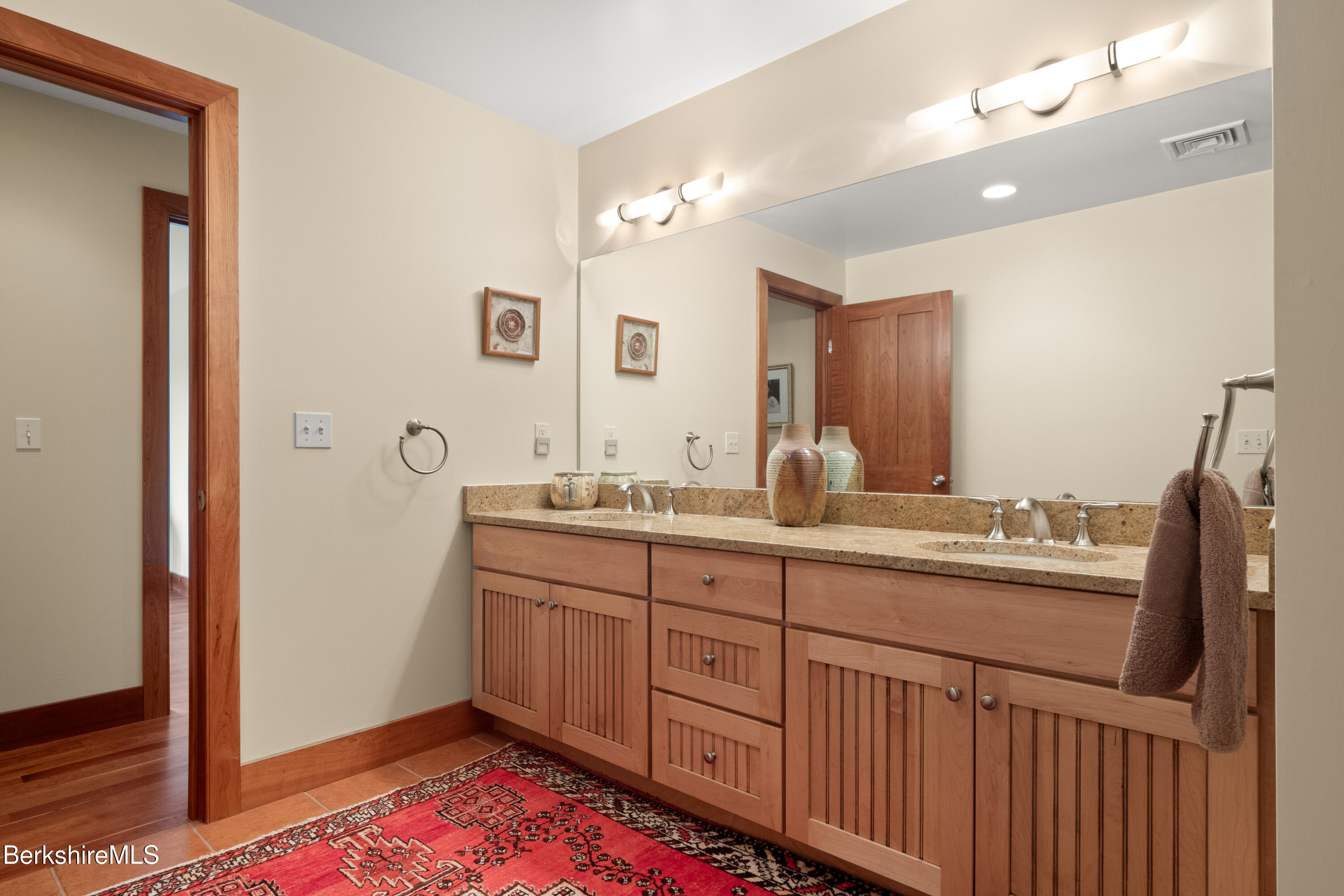 62 Stockbridge Terrace Lee, MA 01238 - Photo 37 of 49 a spacious bathroom with a double vanity sink and a mirror
