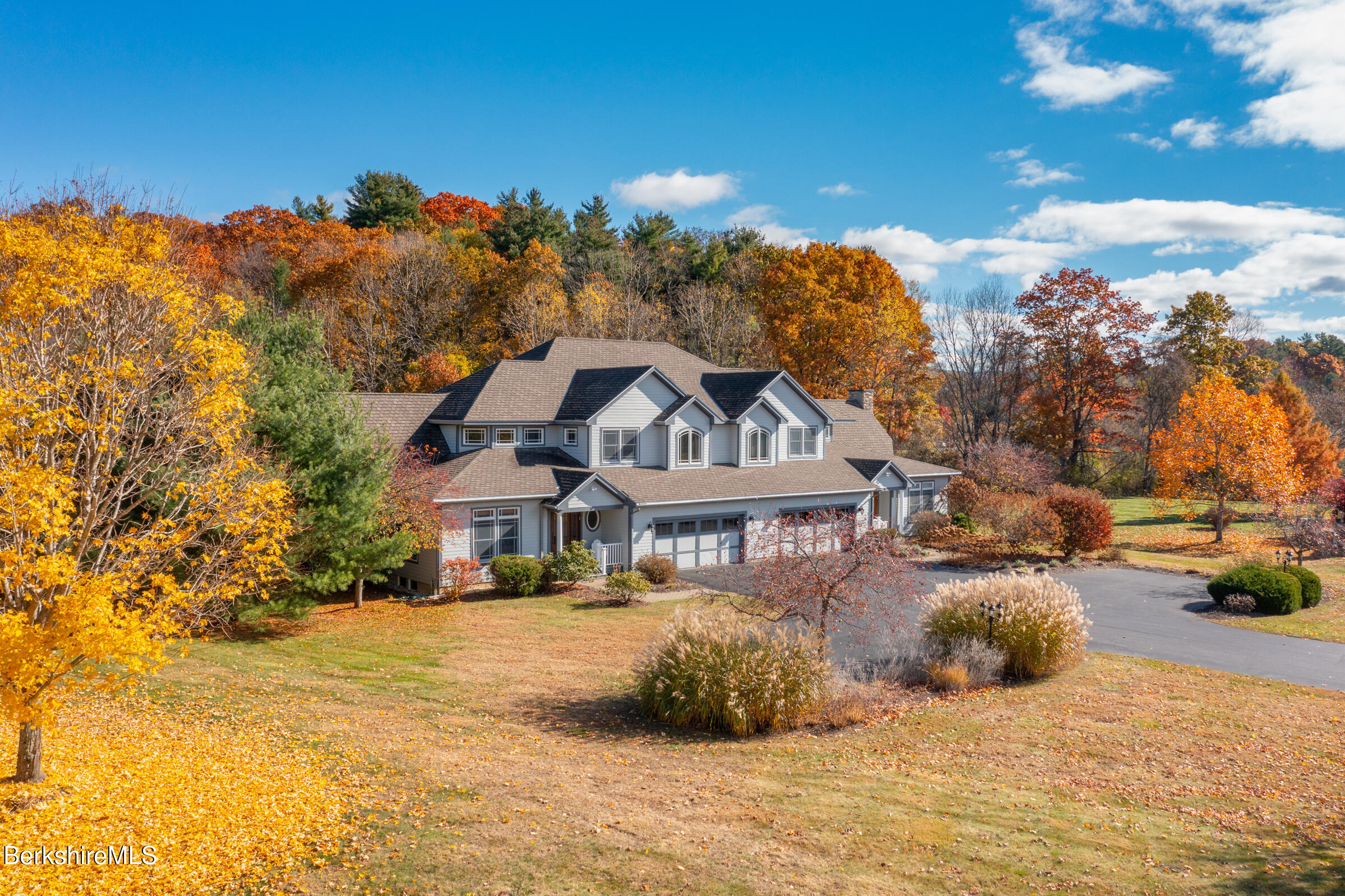 62 Stockbridge Terrace Lee, MA 01238 - Photo 4 of 49 a view of a house with a snow in the yard