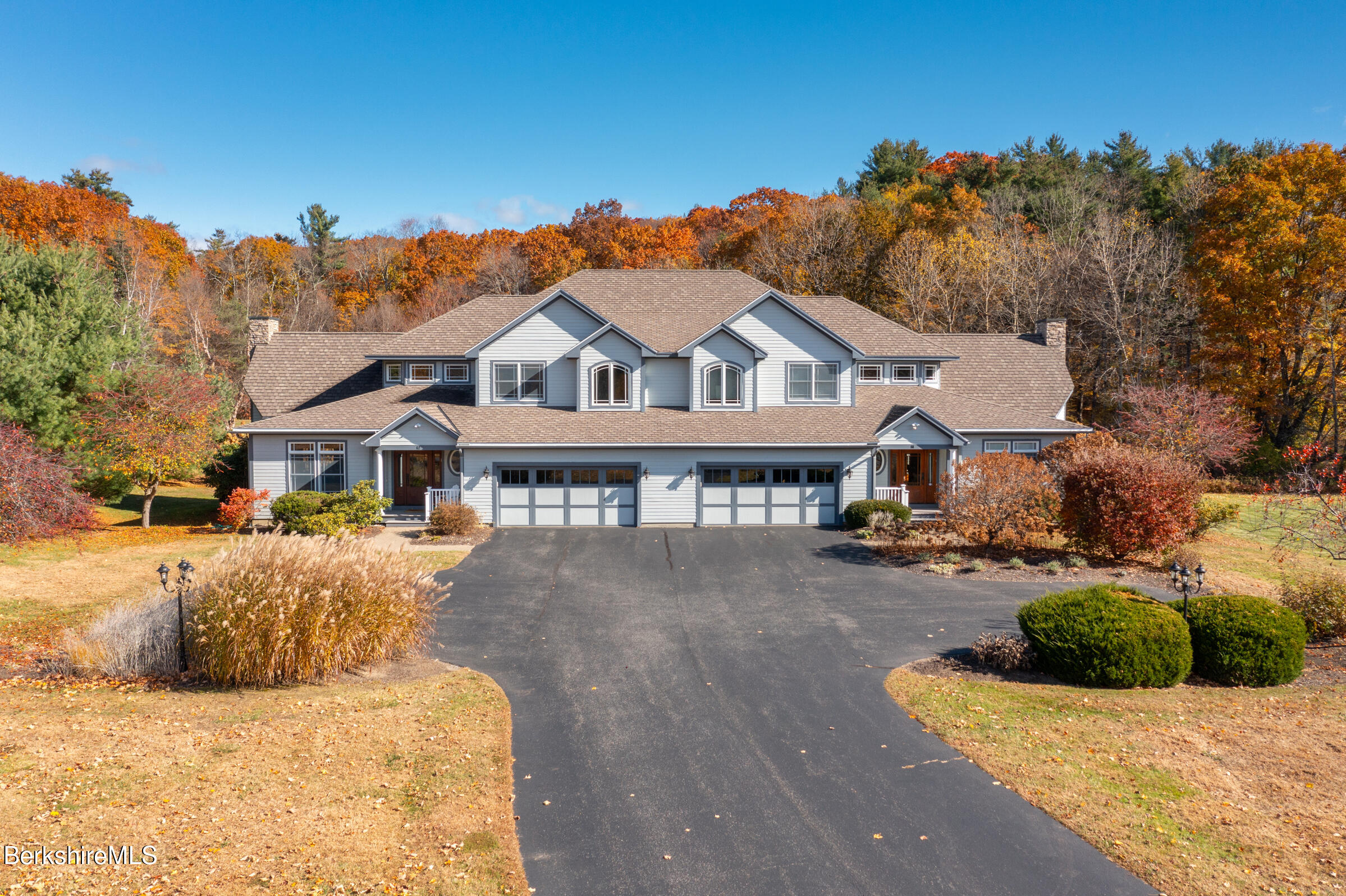 62 Stockbridge Terrace Lee, MA 01238 - Photo 47 of 49 a front view of a house with a yard and garage