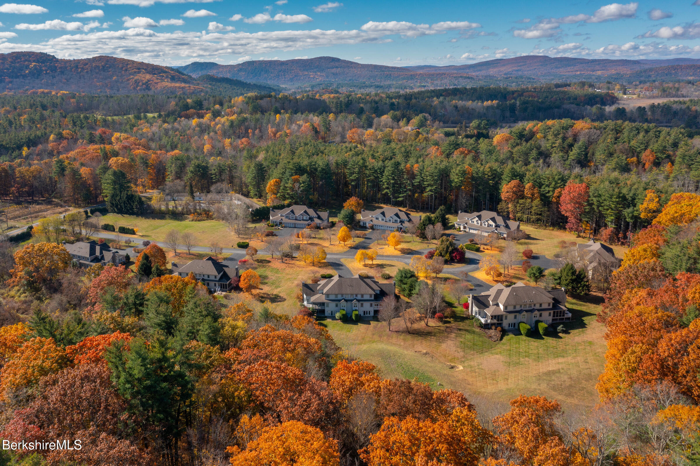 62 Stockbridge Terrace Lee, MA 01238 - Photo 49 of 49 a view of a town with mountains in the background
