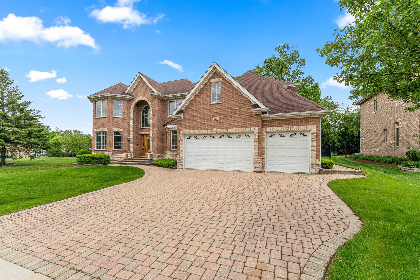 281 Forest Drive Addison, IL 60101 - Photo 4 of 14 a front view of a house with a yard and garage
