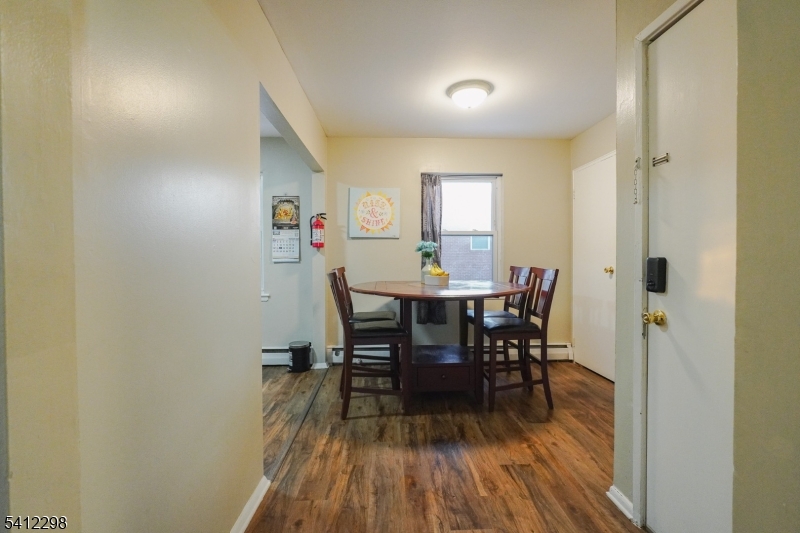 72 Fox Road, Unit 1B Edison, NJ 08817 - Photo 11 of 29 a view of a dining room with furniture and wooden floor