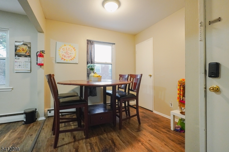 72 Fox Road, Unit 1B Edison, NJ 08817 - Photo 12 of 29 a view of a dining room with furniture and wooden floor