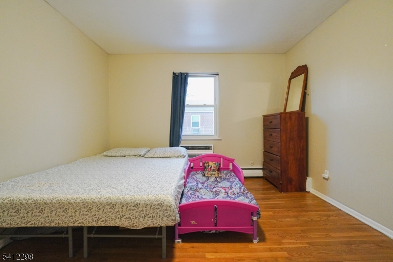 72 Fox Road, Unit 1B Edison, NJ 08817 - Photo 19 of 29 a bedroom with a bed and dresser