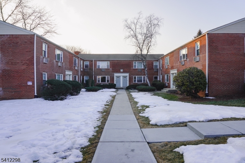 72 Fox Road, Unit 1B Edison, NJ 08817 - Photo 2 of 29 a view of a brick building next to a yard