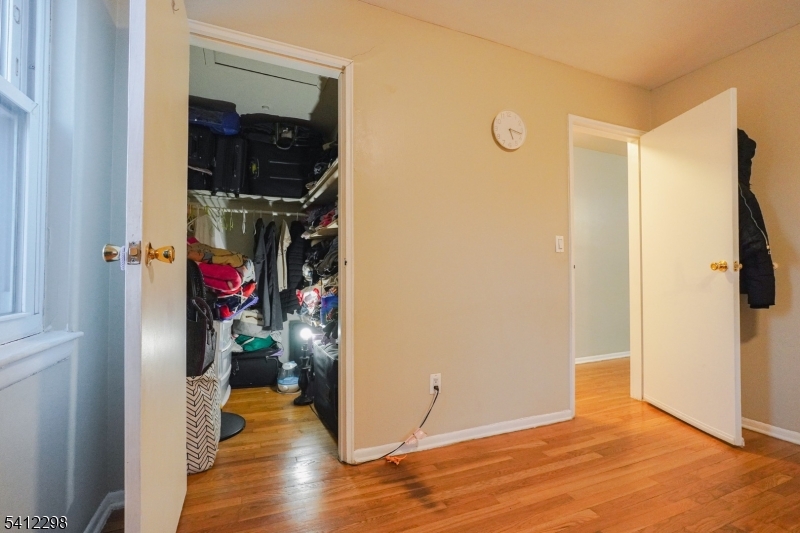 72 Fox Road, Unit 1B Edison, NJ 08817 - Photo 21 of 29 a view of a hallway with wooden floor and closet