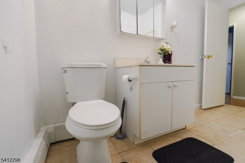 72 Fox Road, Unit 1B Edison, NJ 08817 - Photo 27 of 29 a bathroom with a sink and a toilet