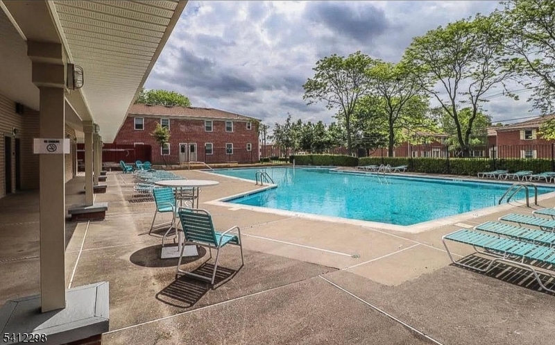 72 Fox Road, Unit 1B Edison, NJ 08817 - Photo 28 of 29 a view of a swimming pool with lounge chair