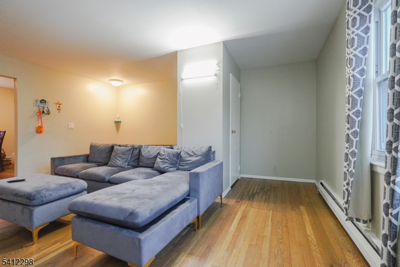 72 Fox Road, Unit 1B Edison, NJ 08817 - Photo 10 of 29 a living room with furniture and a fireplace